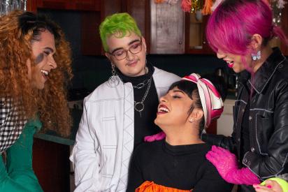 A group of friends of varying genders celebrating